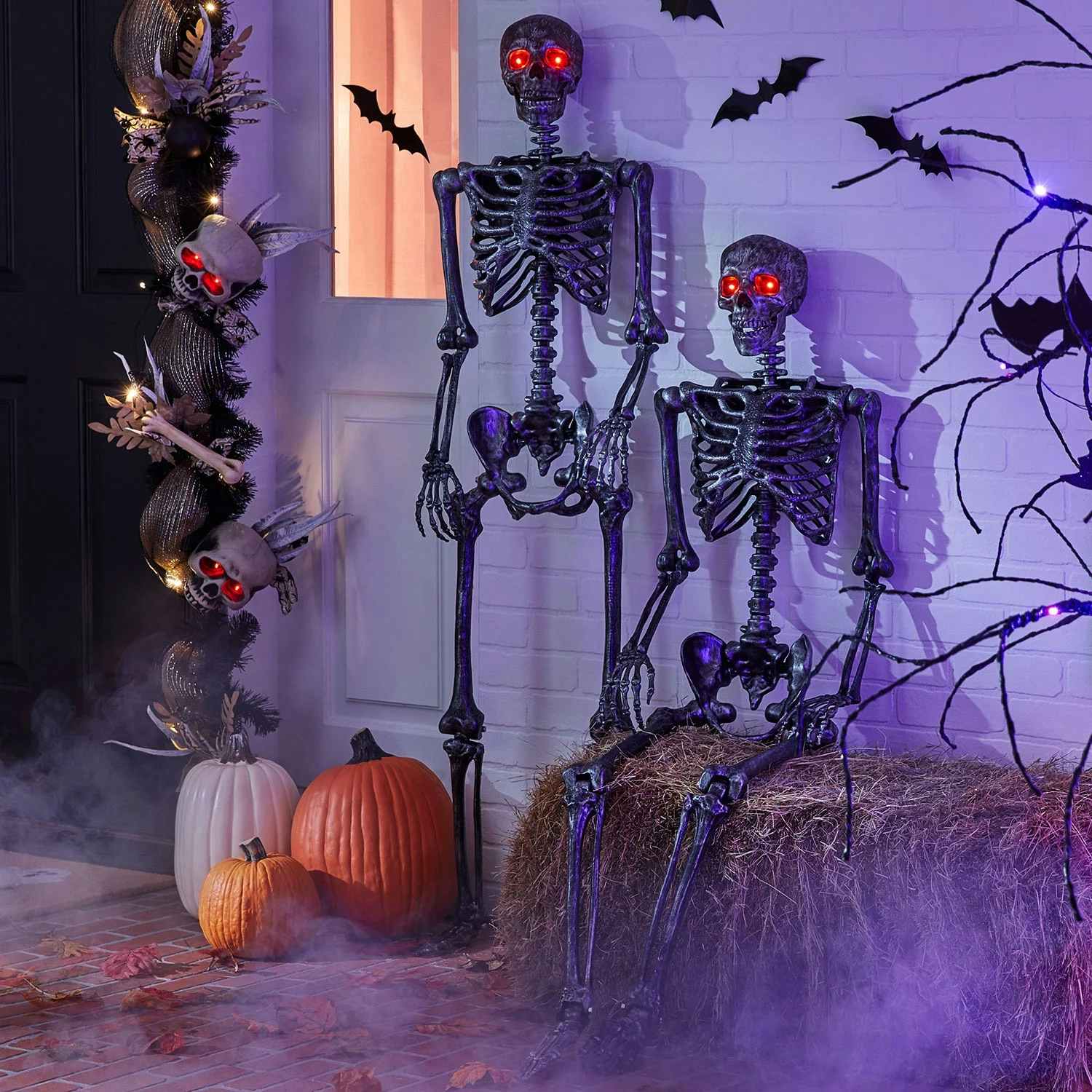 animated halloween skeletons displayed in front of a house