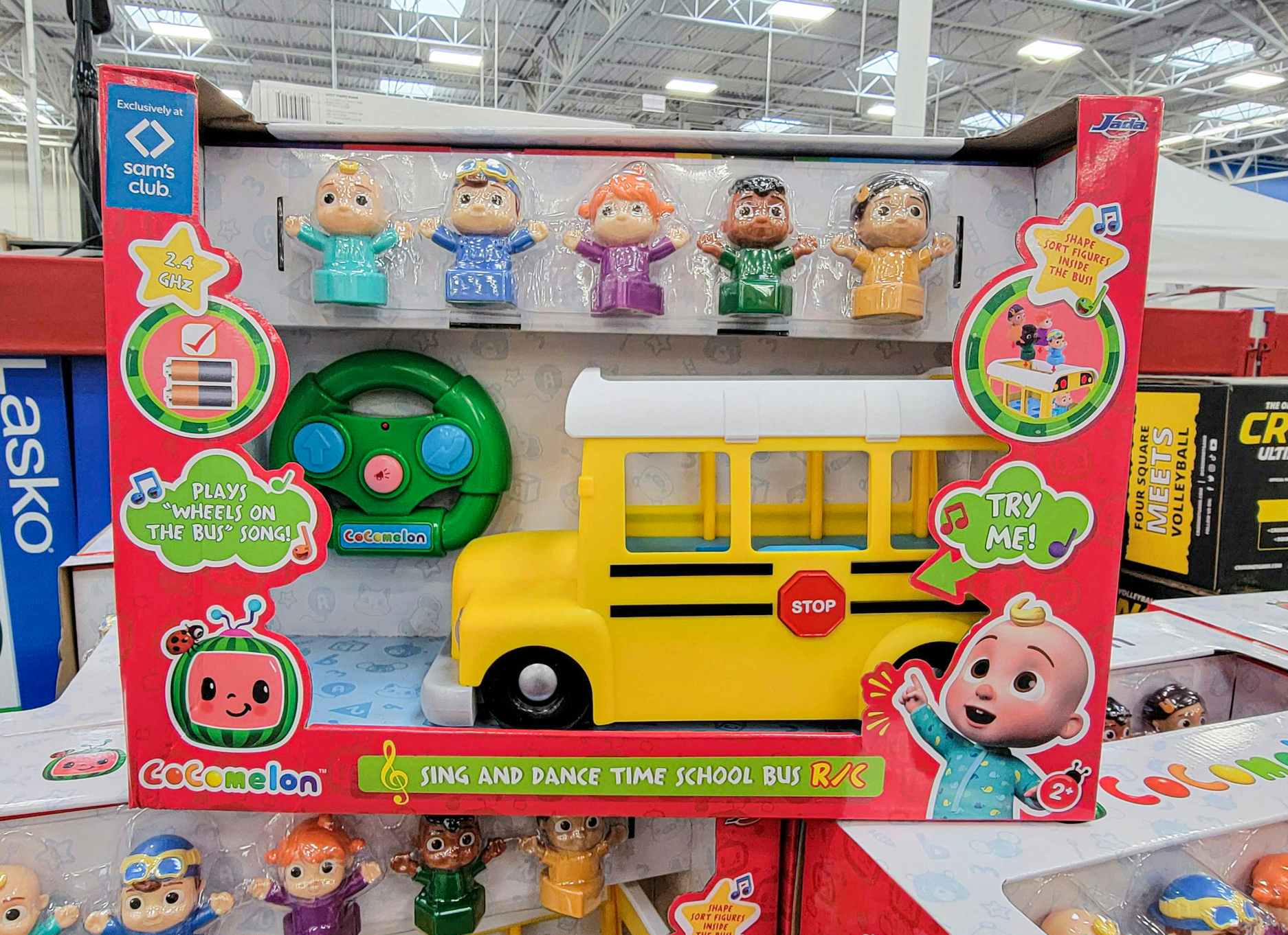 a cocomelon bus playset with characters to put in it