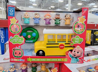 a cocomelon bus playset with characters to put in it