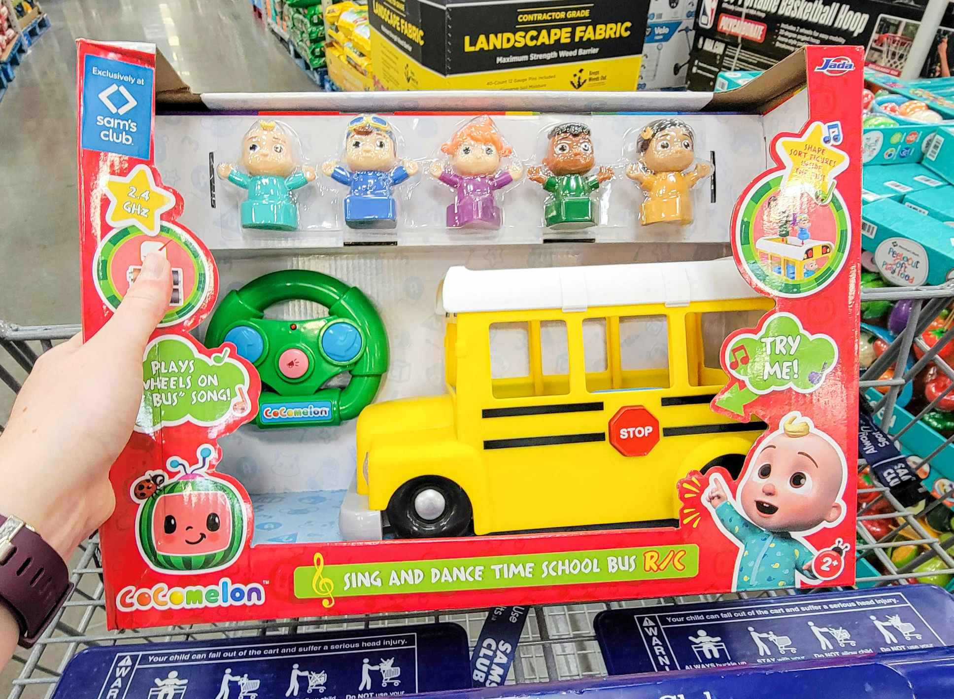 a cocomelon bus toy in a cart