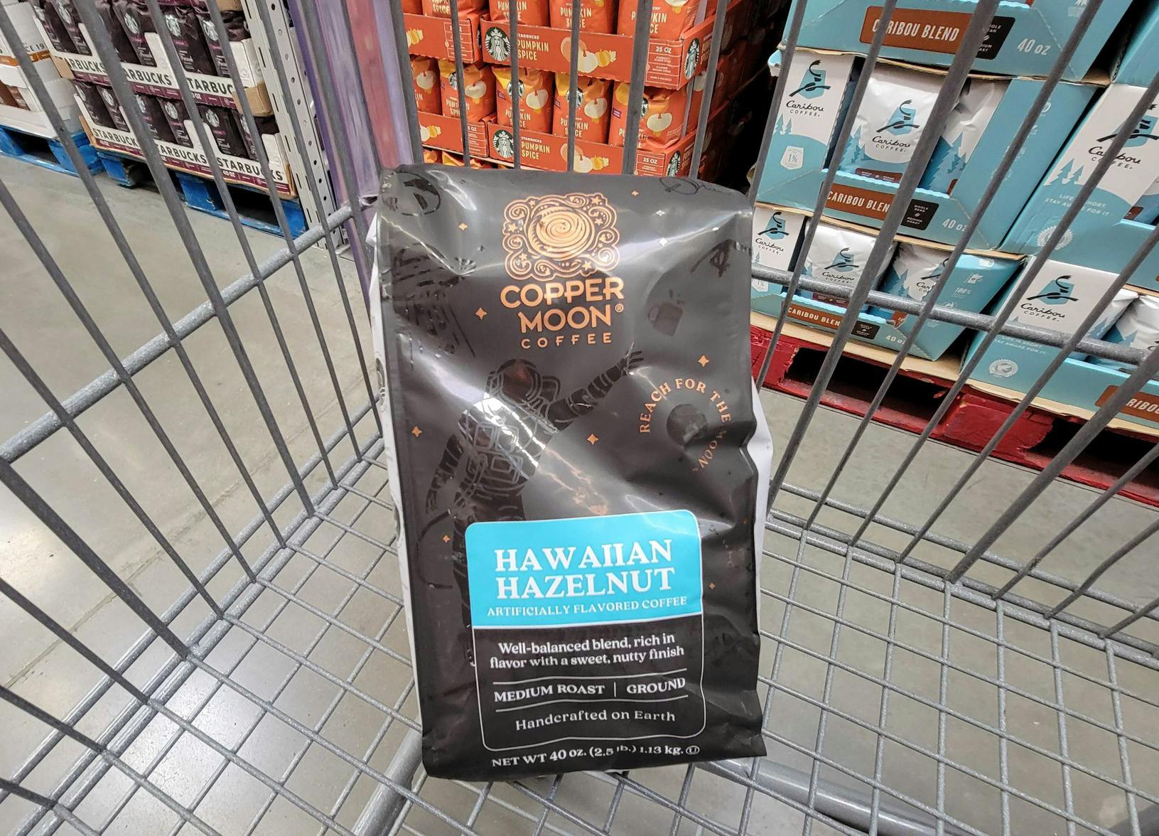 a 40 oz bag of copper moon hawaiian hazelnut coffee grounds in a cart