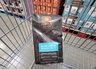 a 40 oz bag of copper moon hawaiian hazelnut coffee grounds in a cart