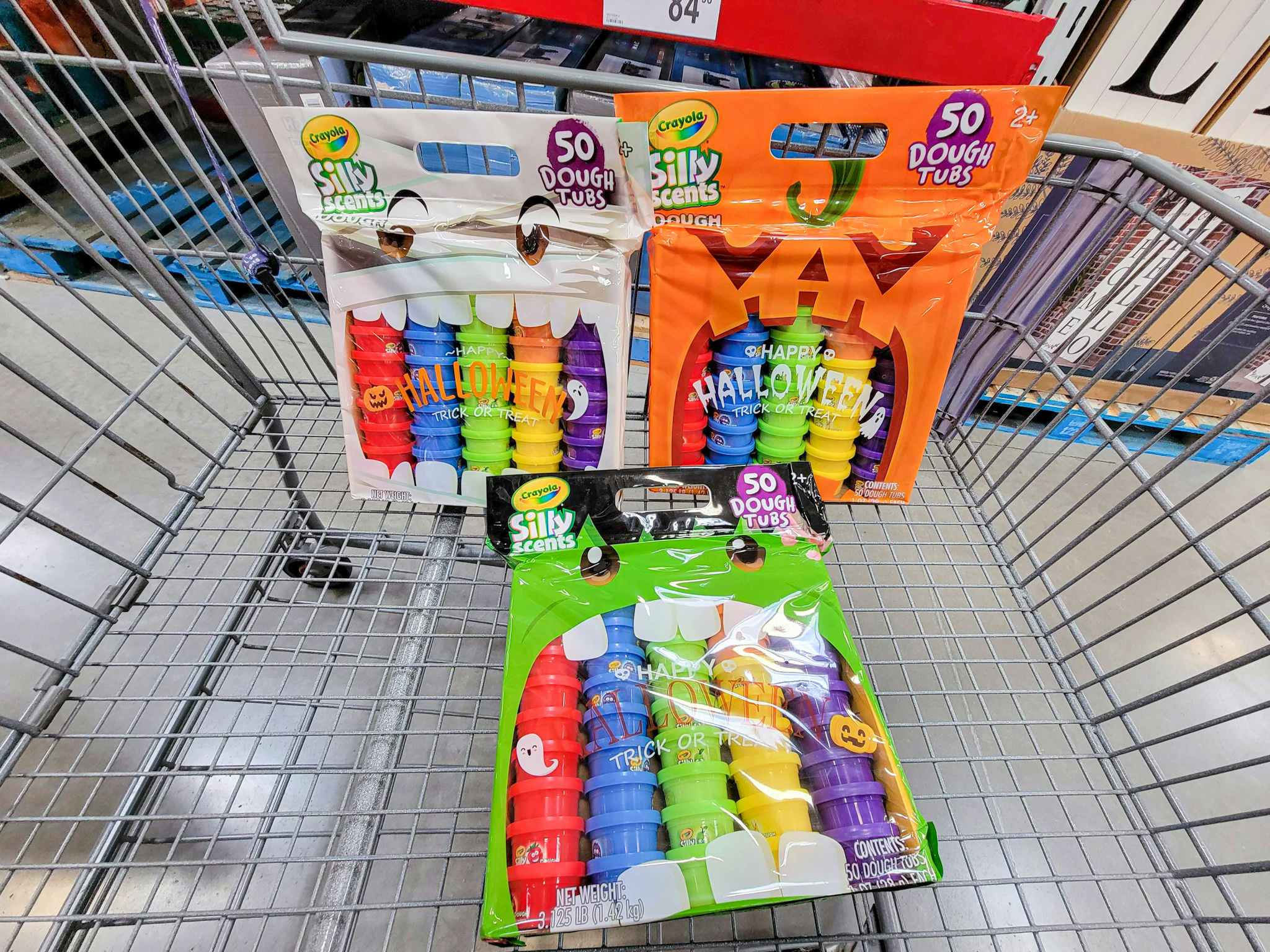 cart with 3 50-packs of crayola silly scents dough for halloween