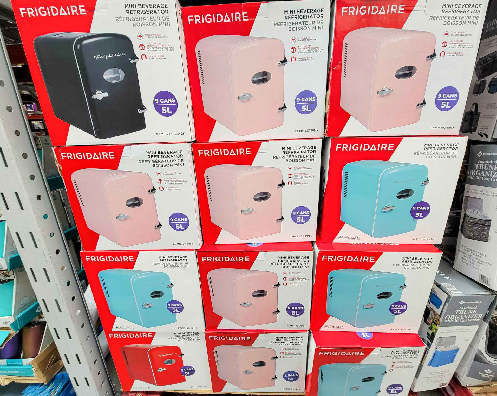 display of mini beverage refrigerators in black, pink, and teal
