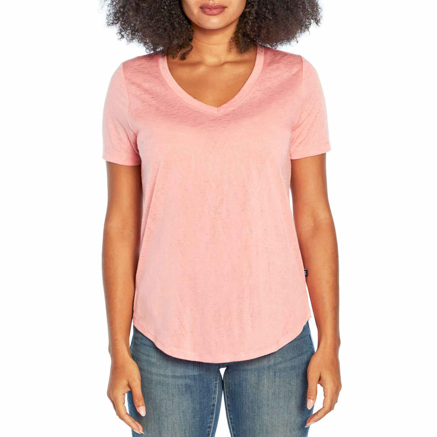woman wearing a peach colored tee