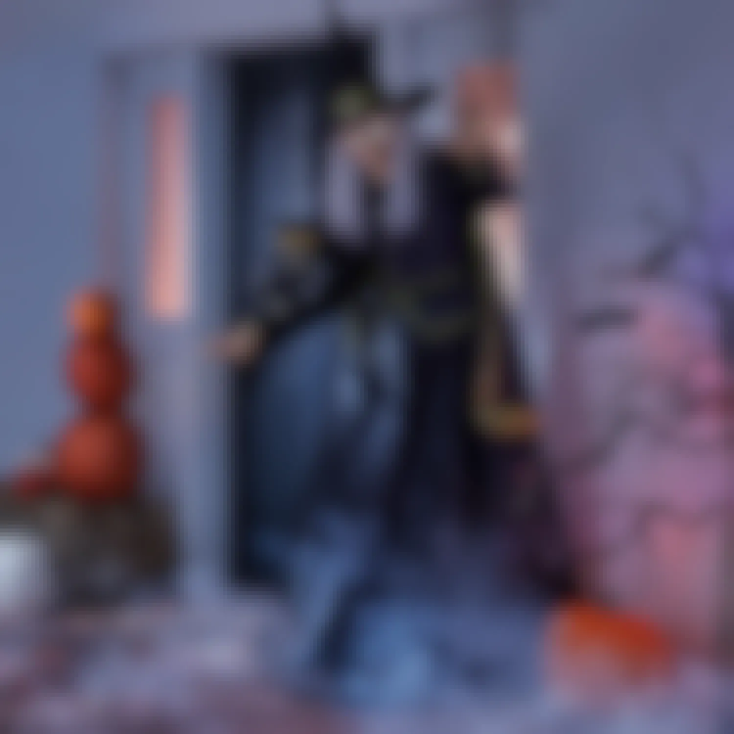 tall animated witch displayed in front of a house for halloween