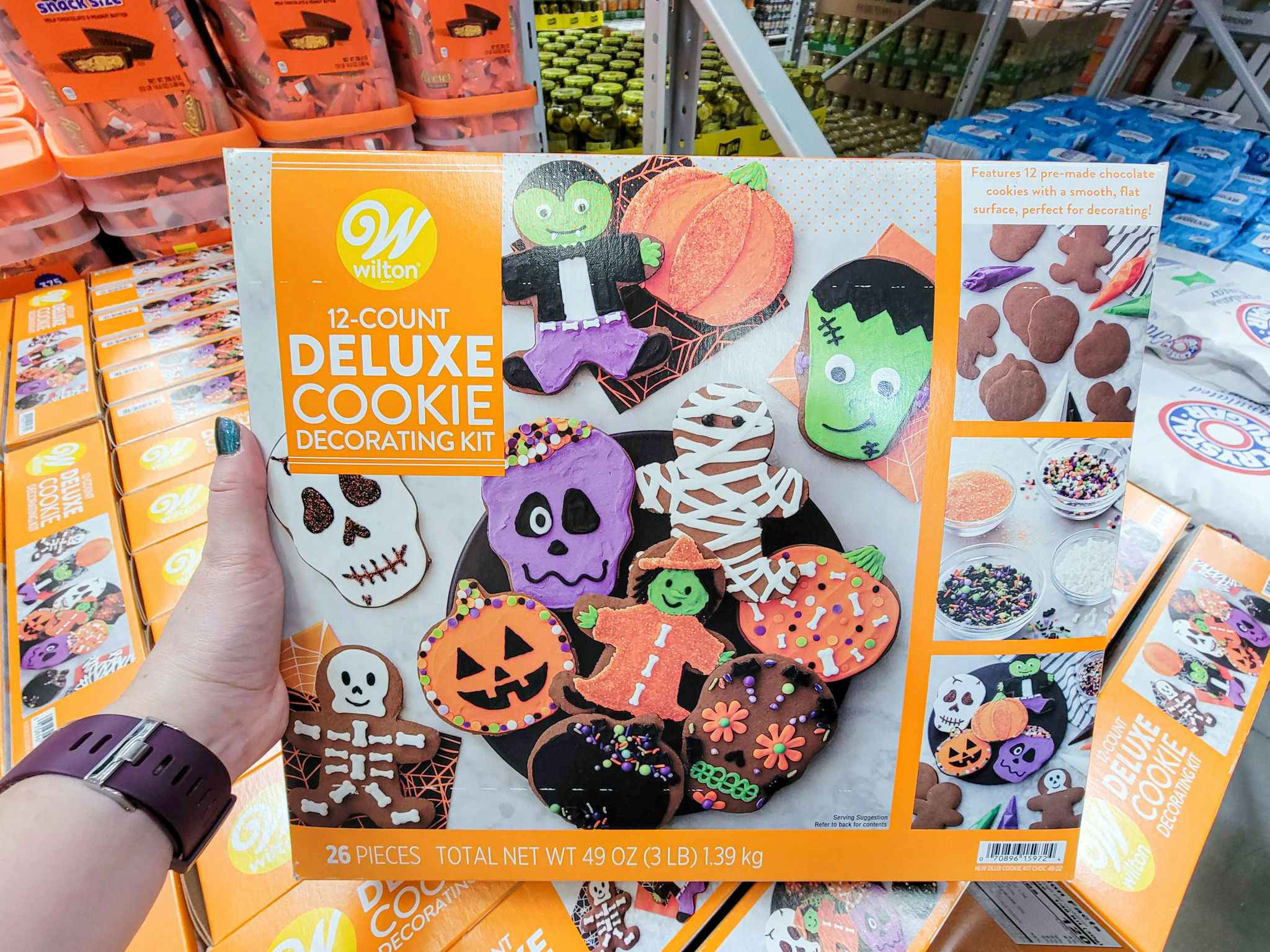 hand holding a halloween cookie decorating kit