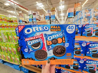 hand holding a box of 40 halloween oreos