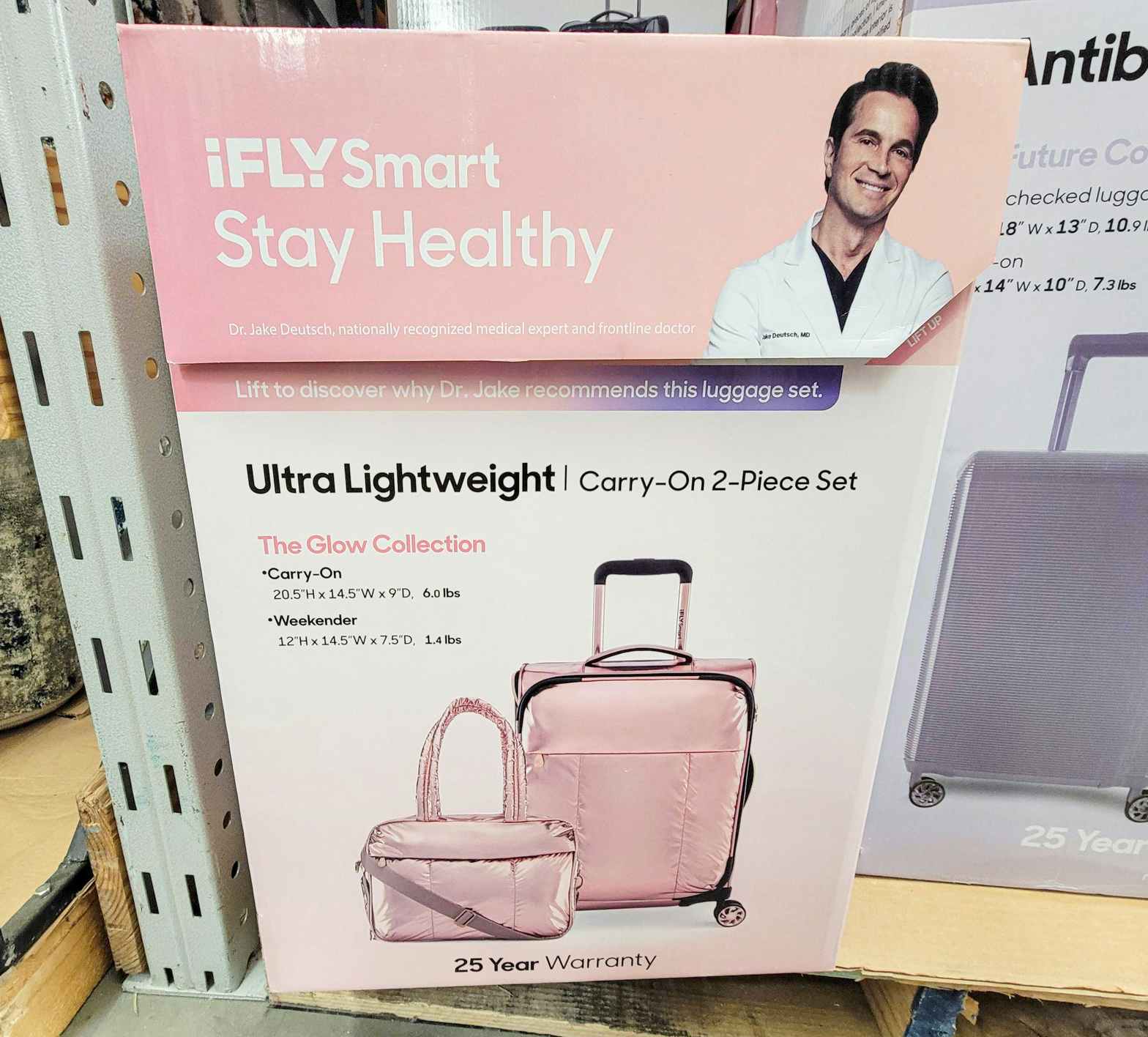 box with a pink 2 piece luggage set