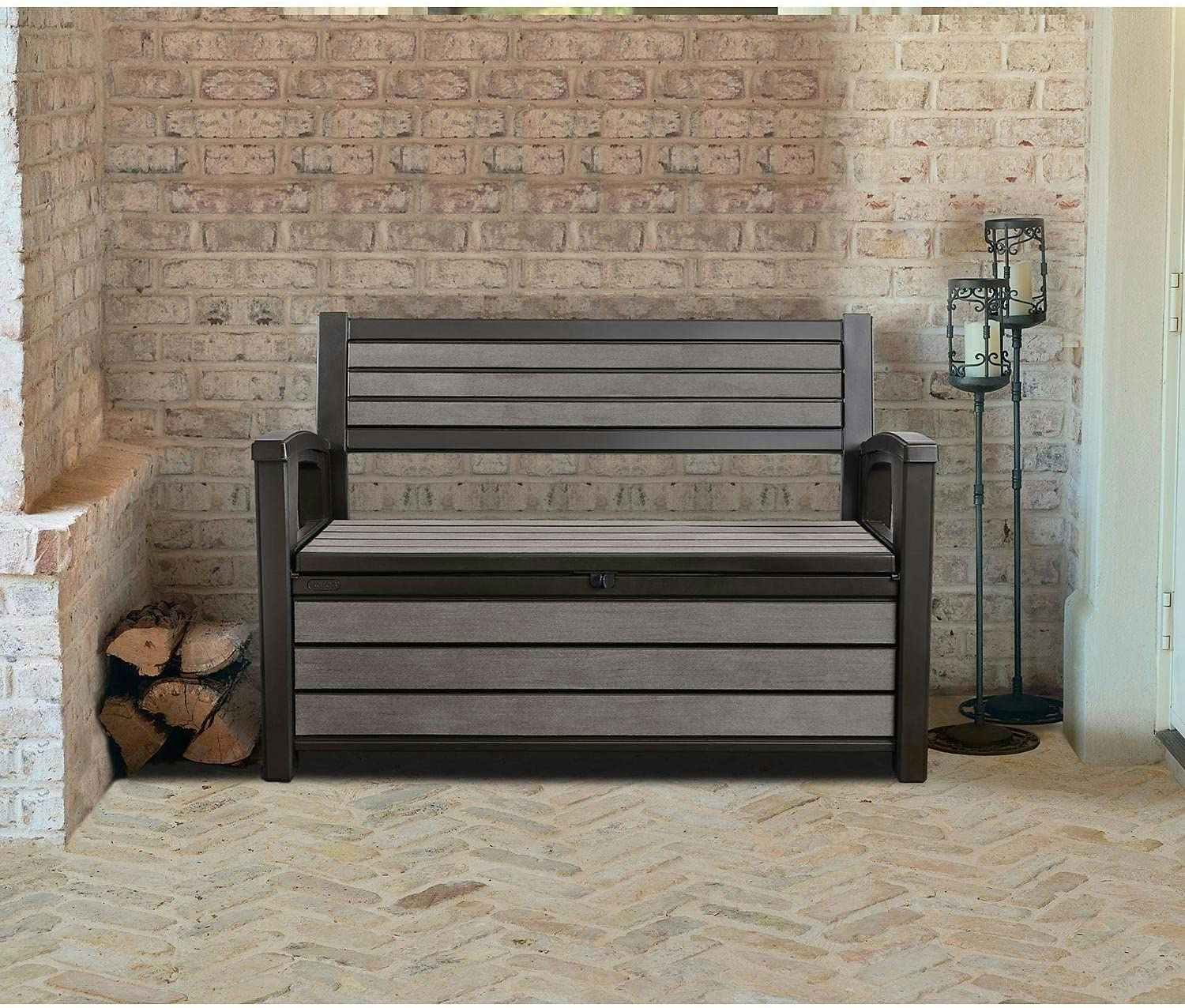 a brown keter storage bench on a patio