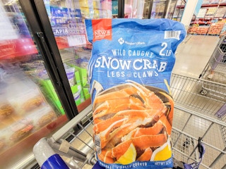 large bag of snow crab legs & claws in a cart
