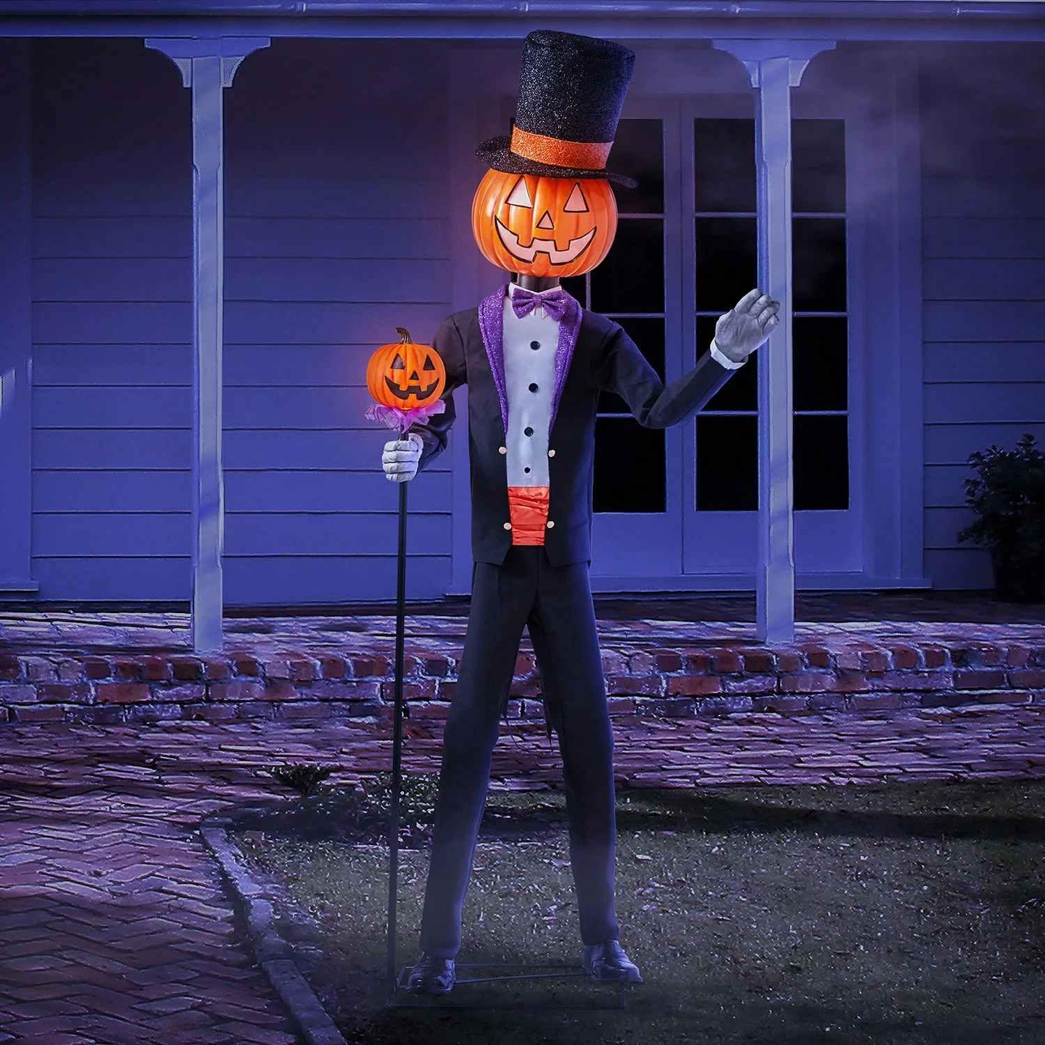 8.5 foot tall mr. halloween animated character with a pumpkin head displayed in front of a house