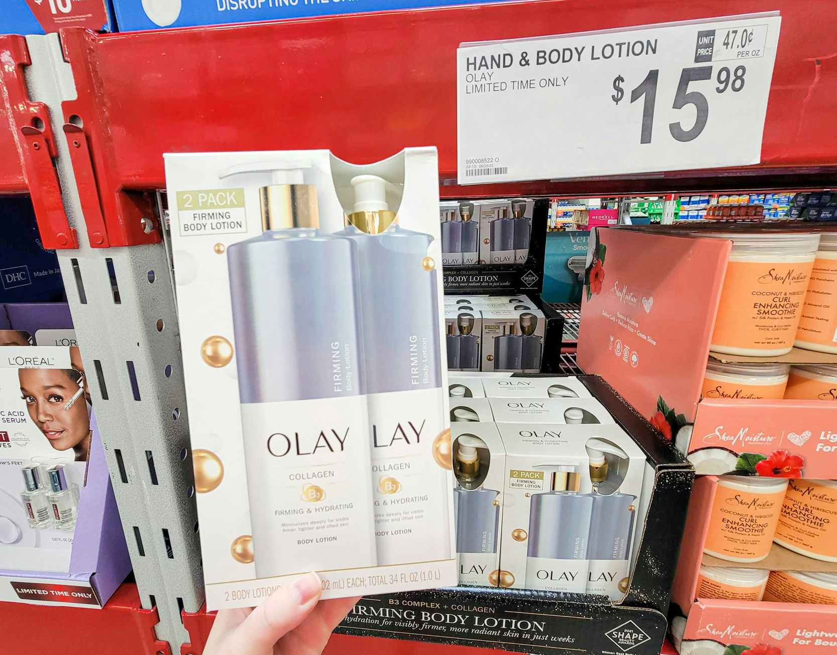 hand holding a 2-pack of olay firming body lotion