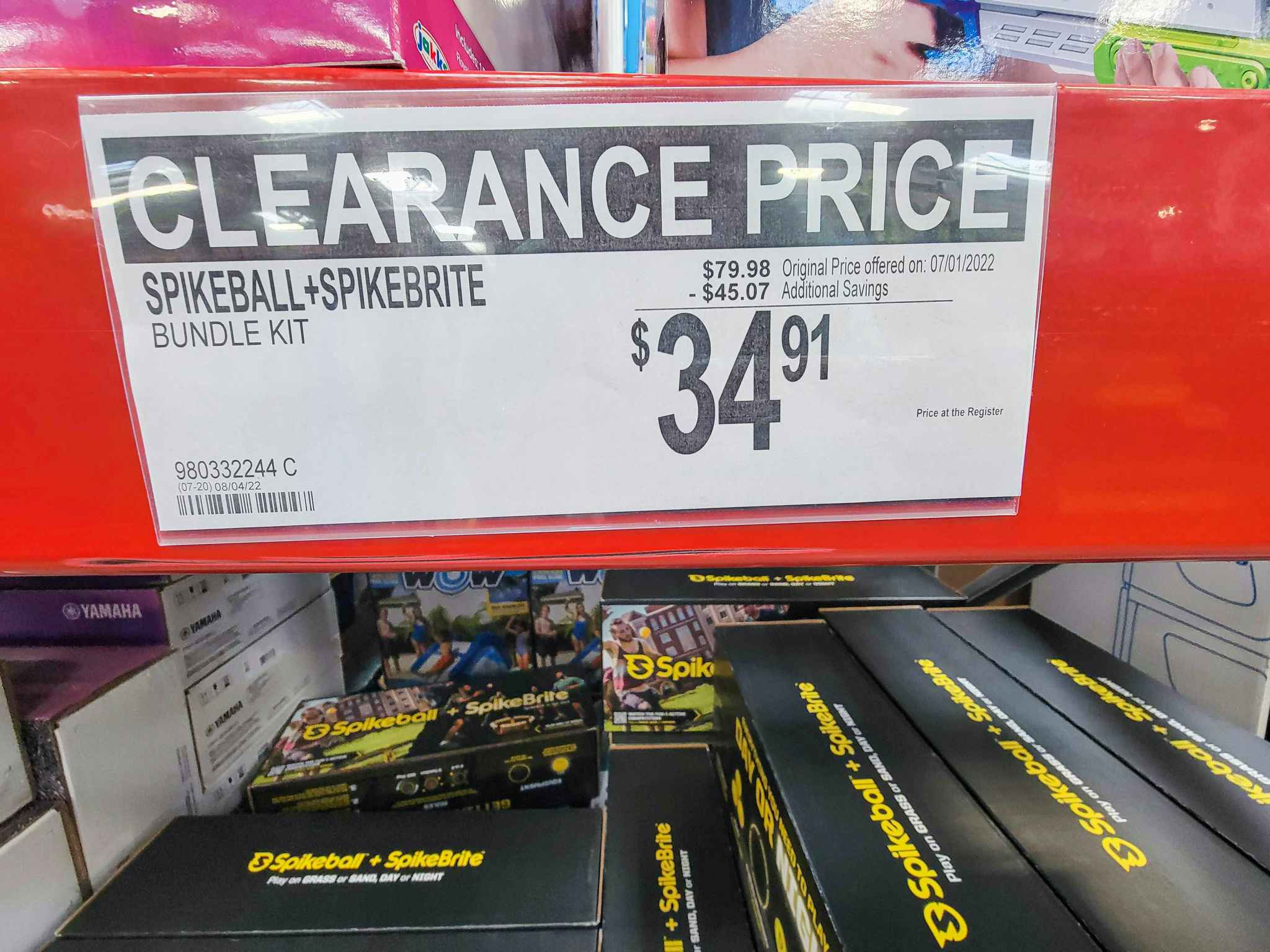 clearance sign for spikeball and spikebrite bundle for $34.91