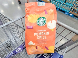 a bag of pumpkin spice starbucks coffee in a cart