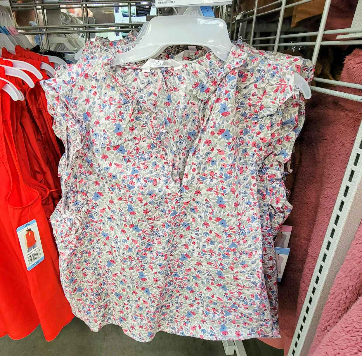 a white with red small flowers printed ladies top