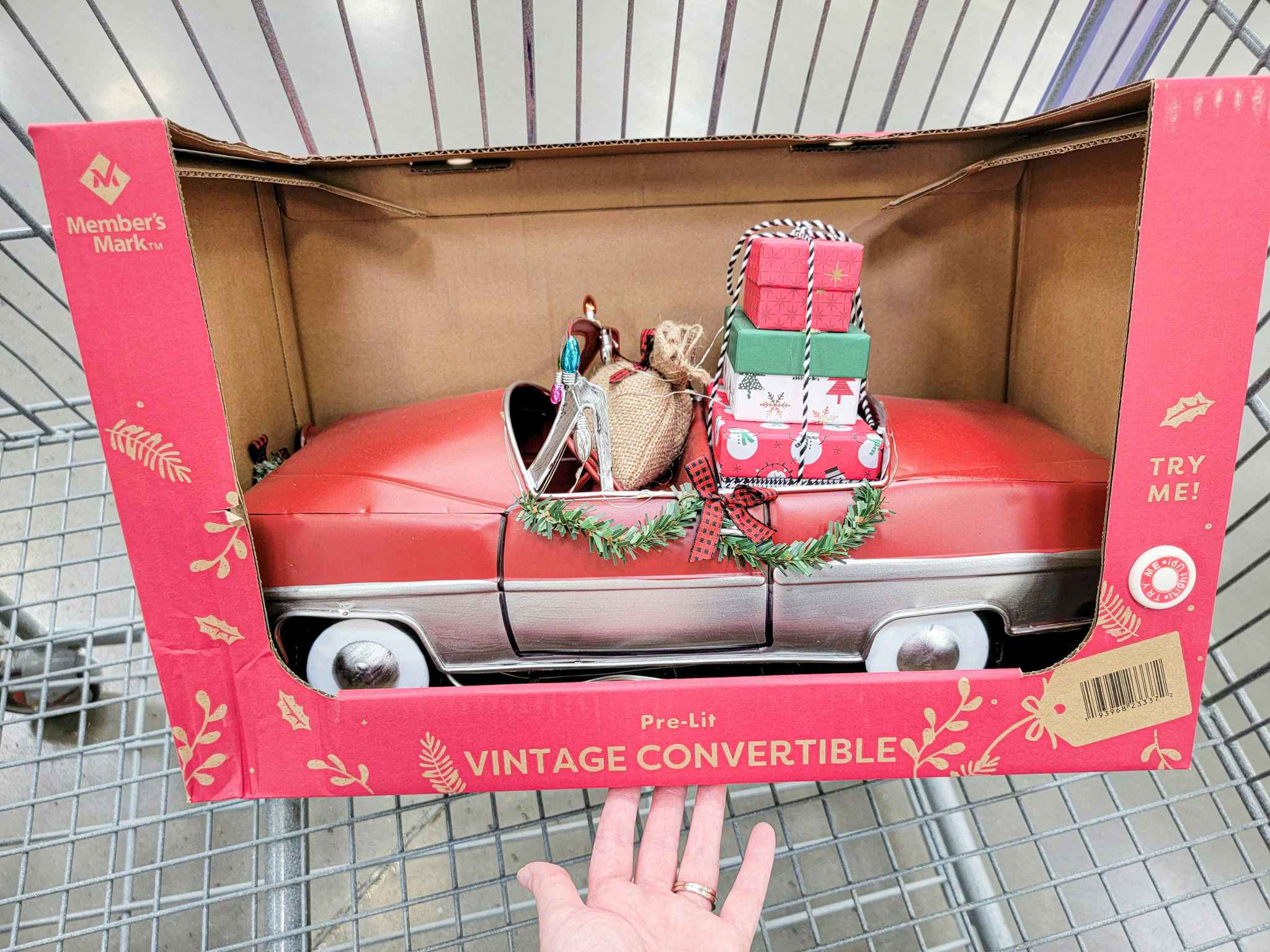 a vintage convertible for christmas decorations in a cart