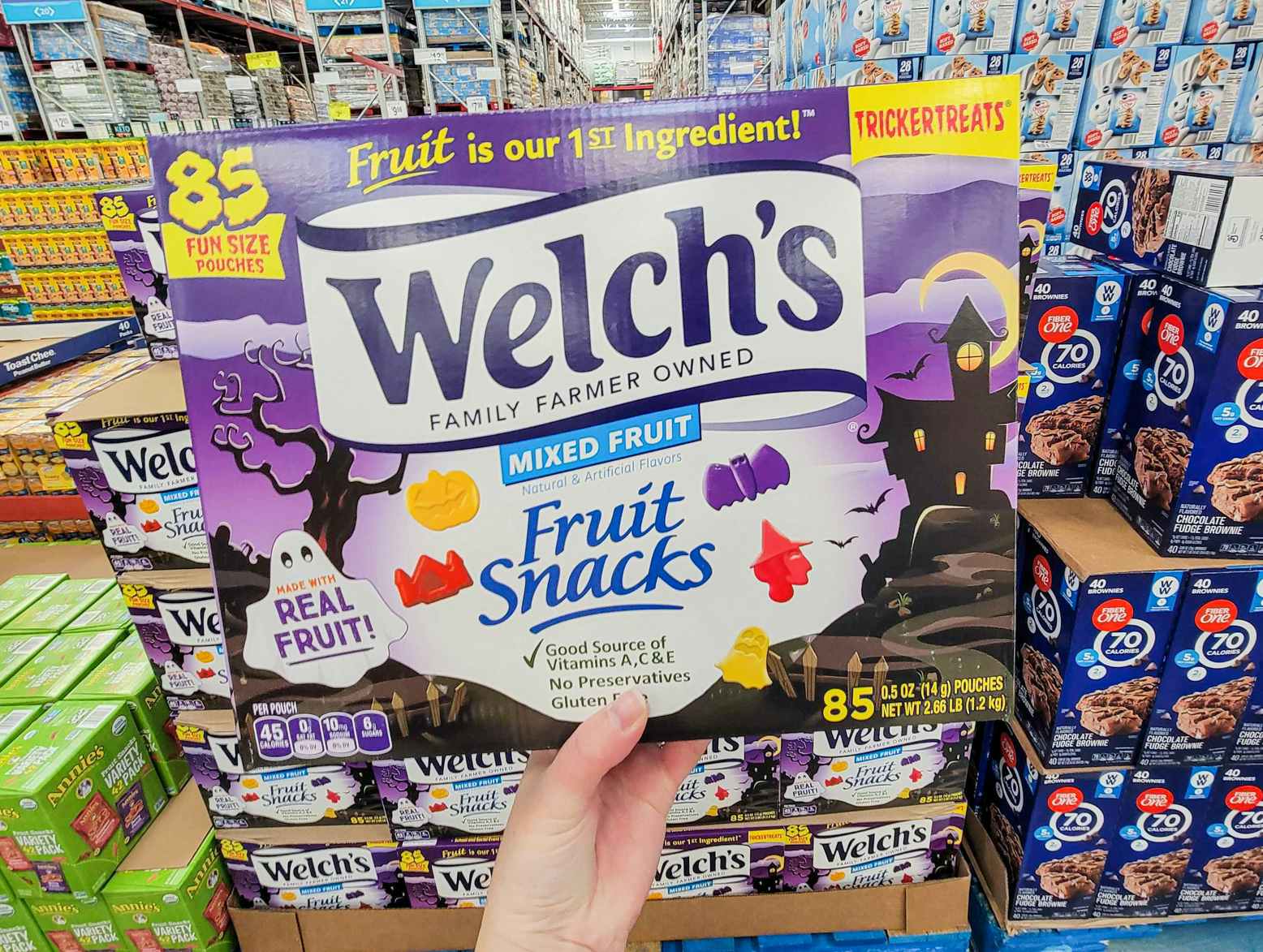hand holding a box of 85 halloween themed welch's fruit snacks