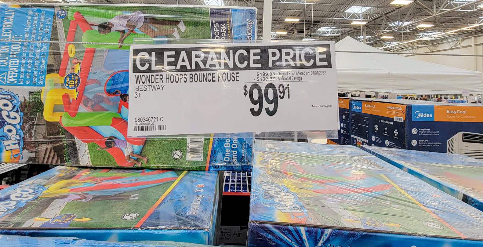 clearance sign for wonder hoops bounce house for $99.91