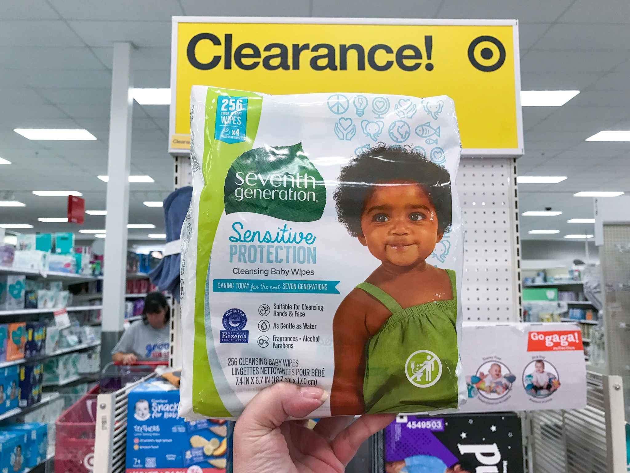 hand holding seventh generation free & clear baby wipes at target