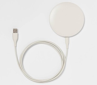 stock photo of a white phone charging puck from Target
