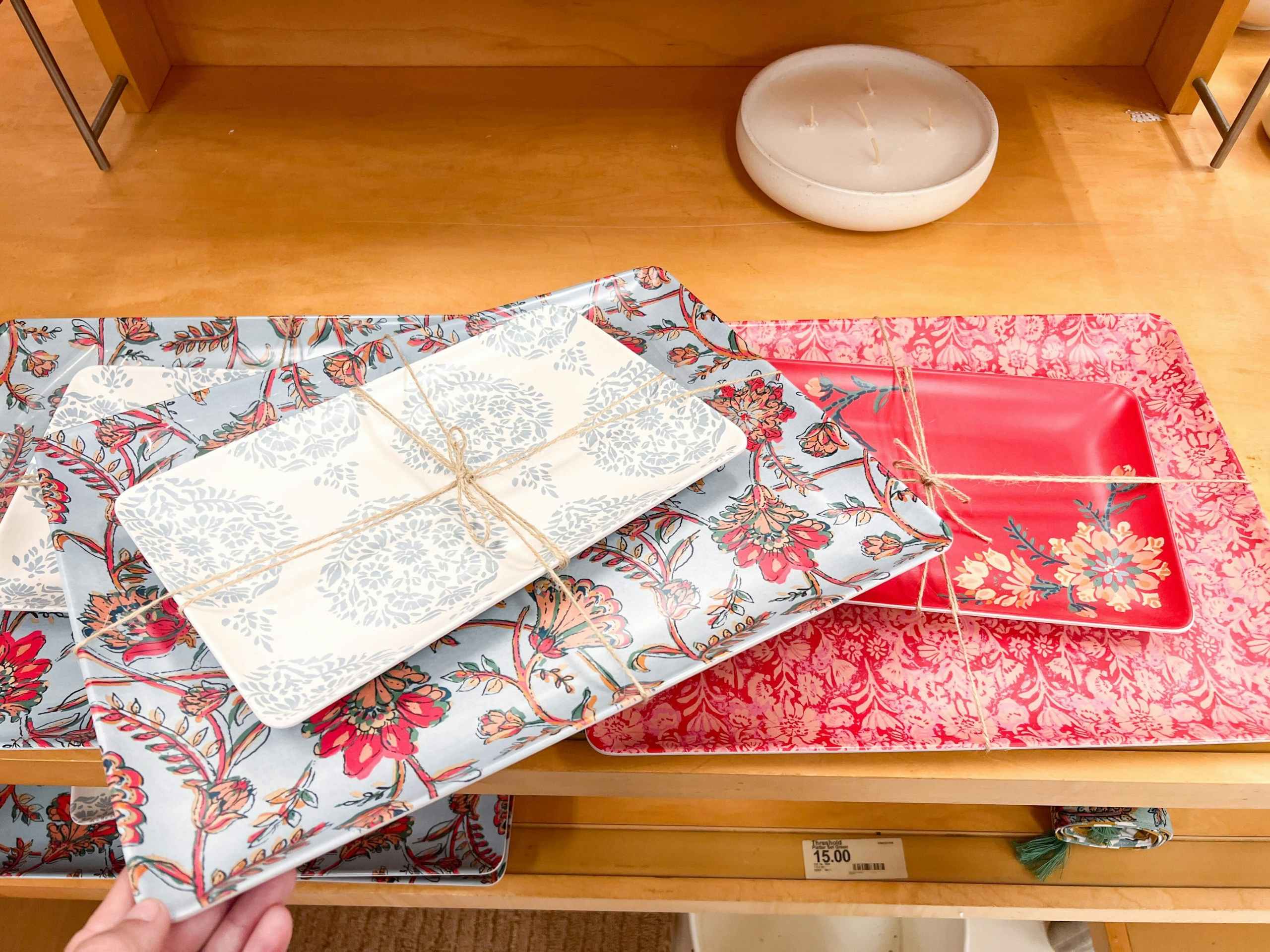 red and blue patterned Threshold platter sets sitting on a wood shelf at Target