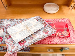 red and blue patterned Threshold platter sets sitting on a wood shelf at Target