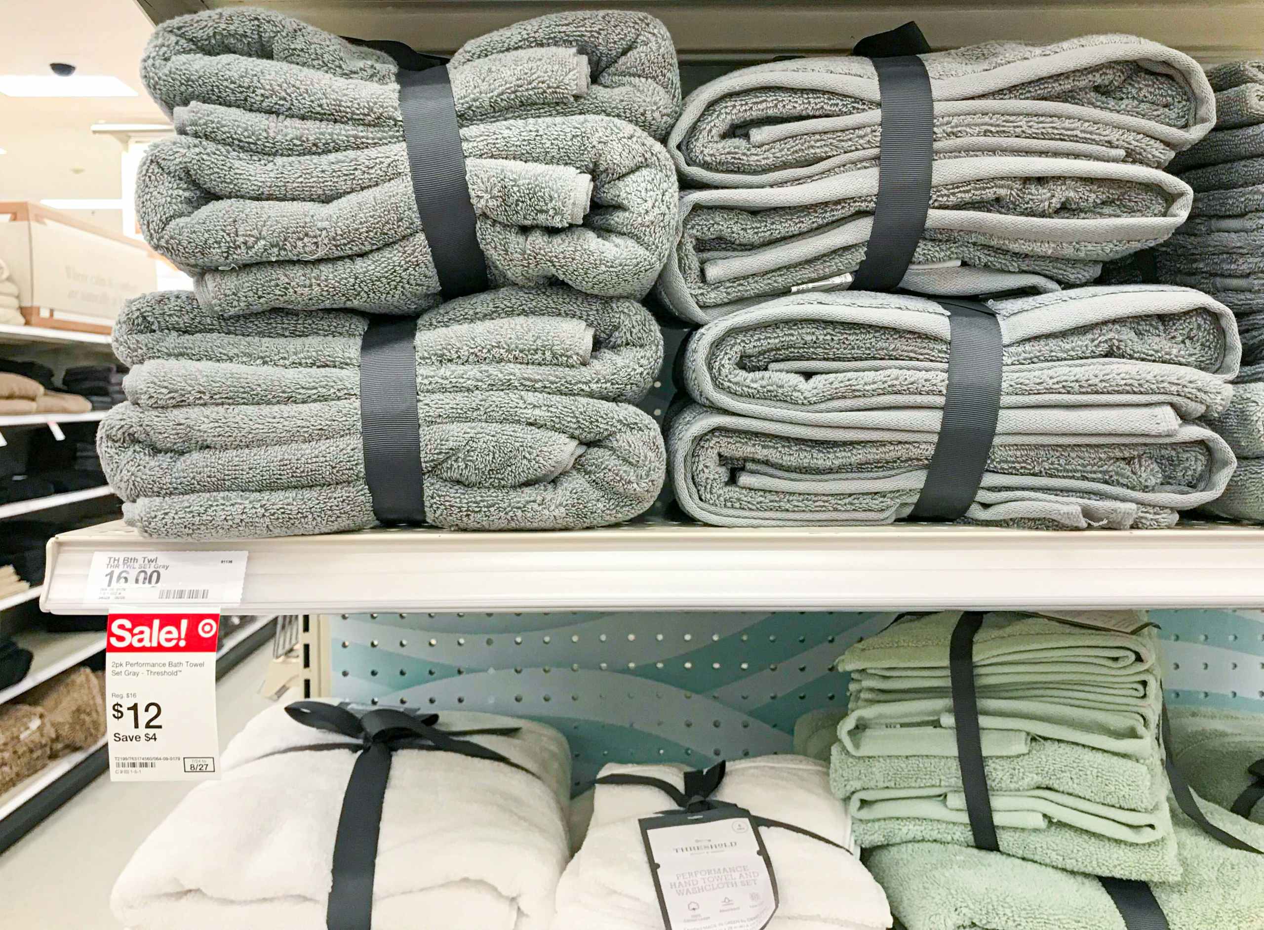 Multiple Threshold towel sets on Target shelf with sale price tag showing