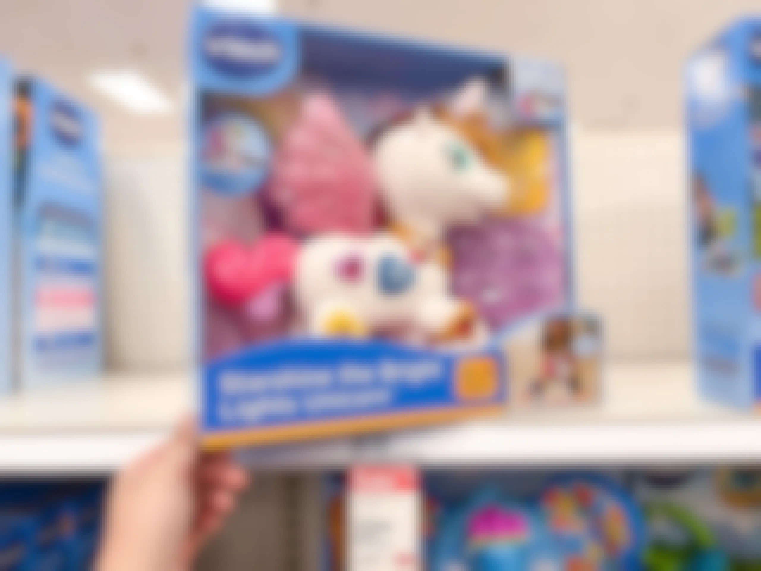 hand holding a Vtech Unicorn on a Target shelf with the sale price and regular price showing