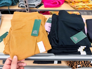 mustard yellow and black Wild Fable high waisted biker shorts on a shelf