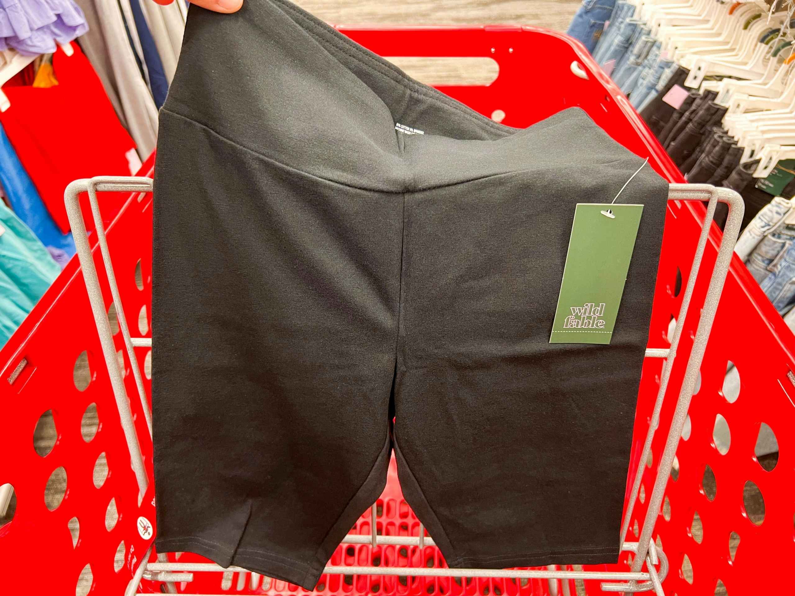 black Wild Fable high waisted biker shorts in the front of a Target cart