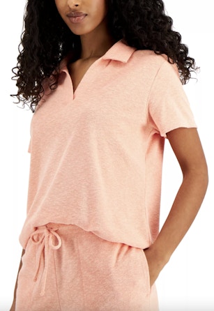 a women wearing a pink terry cloth shorts set