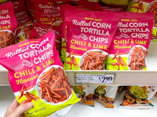 trader joes chili and lime-flavored rolled corn tortilla chips on store shelf