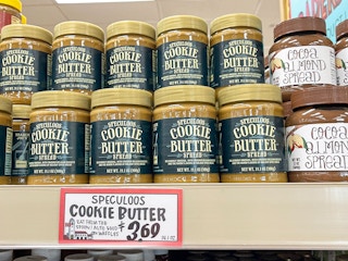 Trader Joe's Speculoos Cookie Butter stocked on a shelf at Trader Joe's.