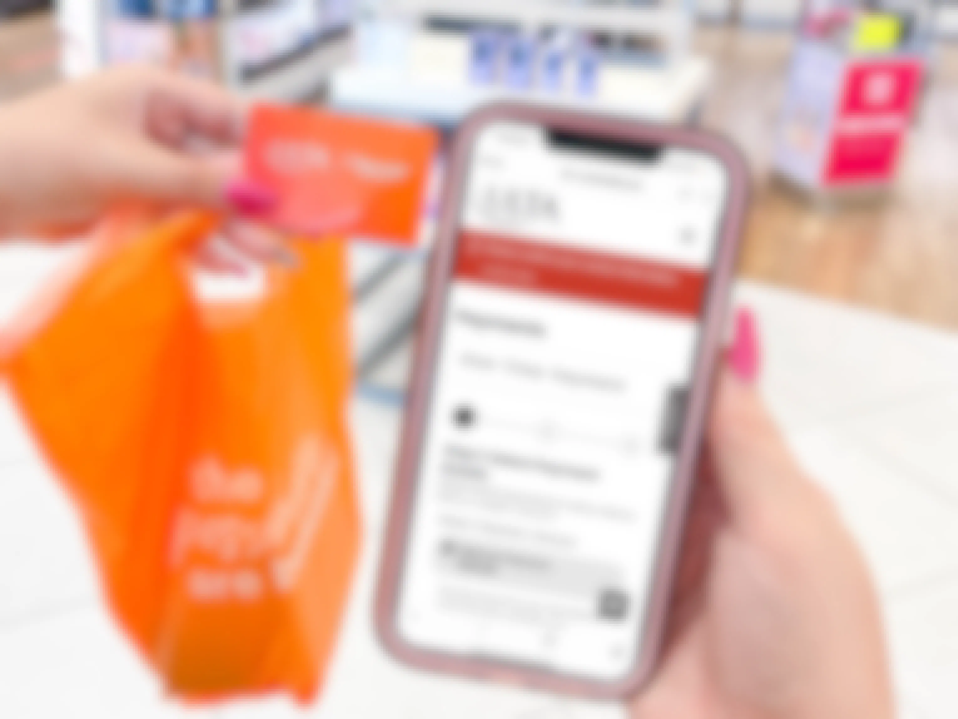a woman holding a ulta bag and ulta credit card and a cellphone with app to make a payment