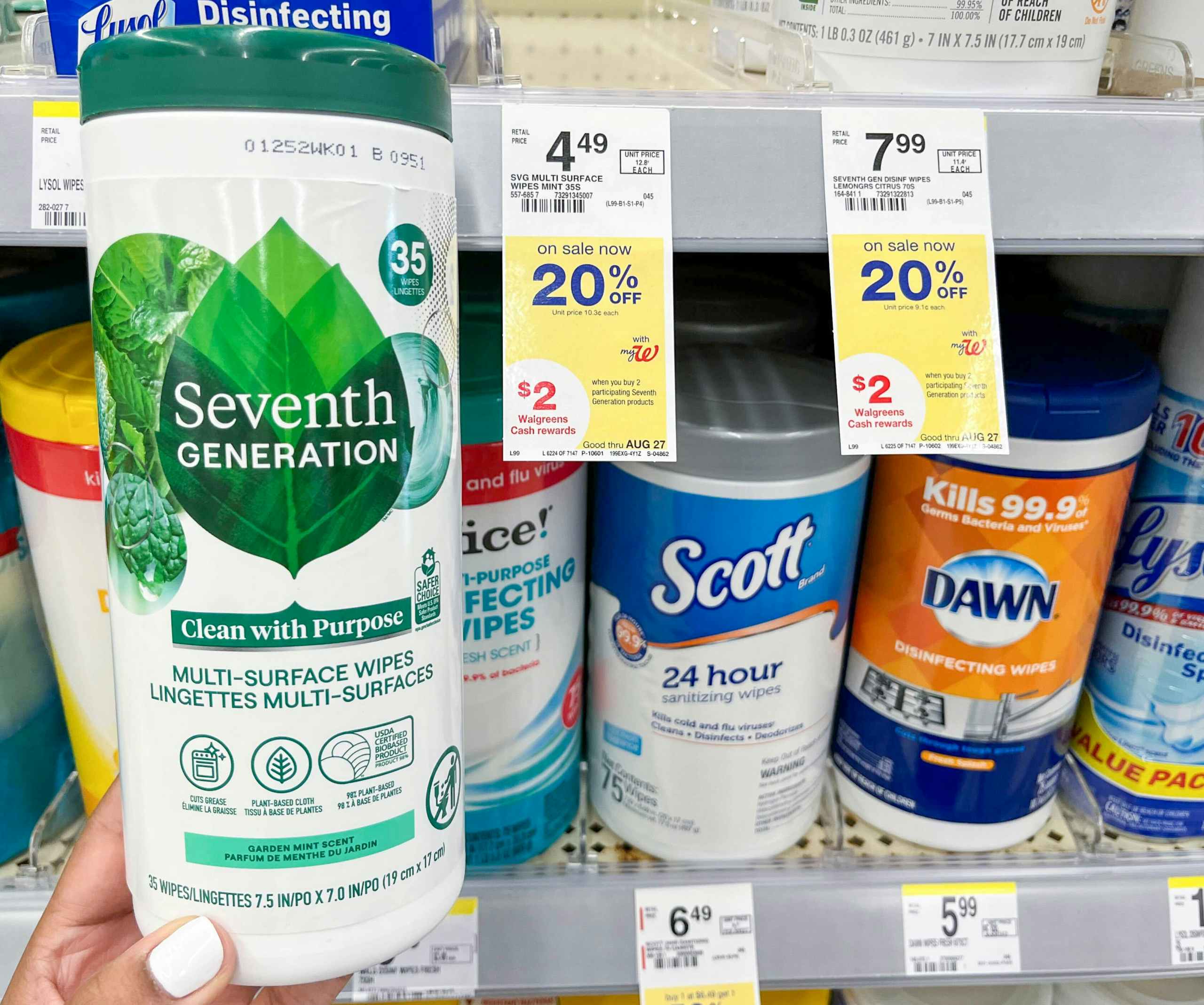 hand holding container of Seventh Generation wipes next to sales tag
