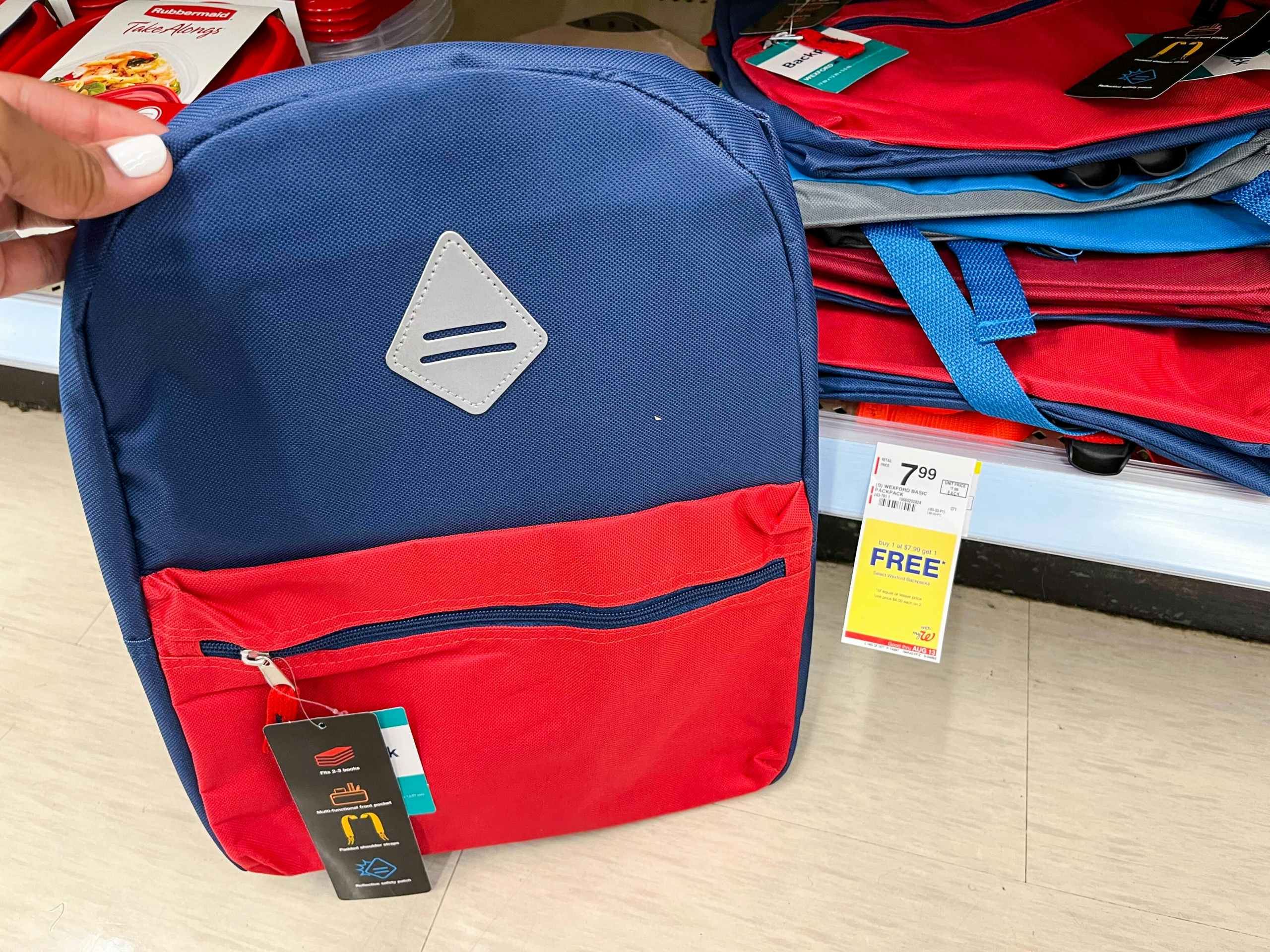 hand holding Wexford backpack next to sales tag