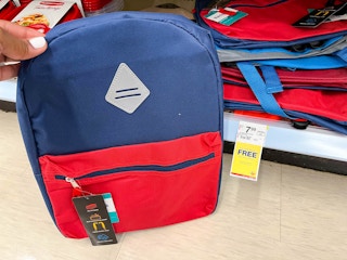 hand holding Wexford backpack next to sales tag