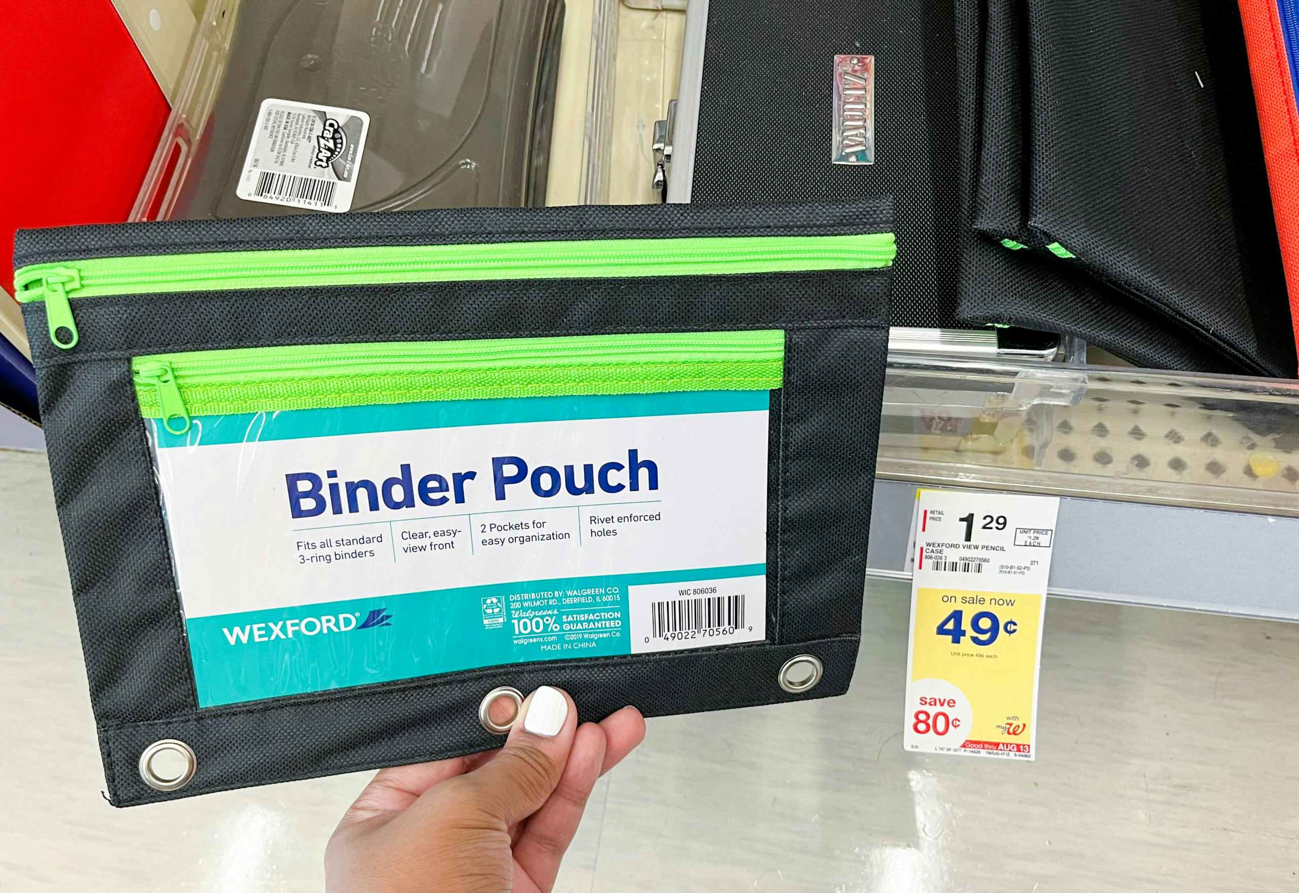 hand holding Wexford binder pouch next to sales tag