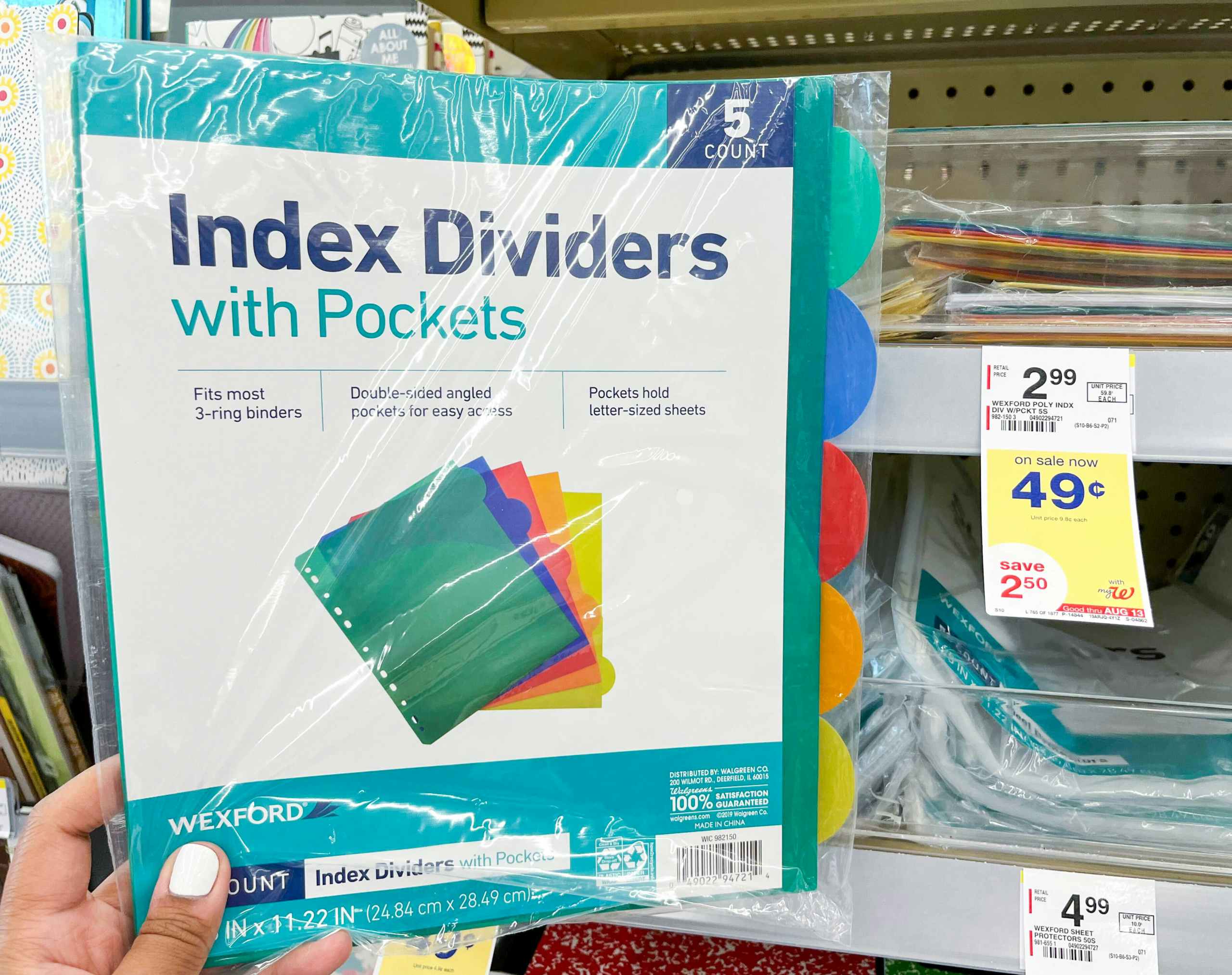 hand holding Wexford index dividers with pockets next to sales tag