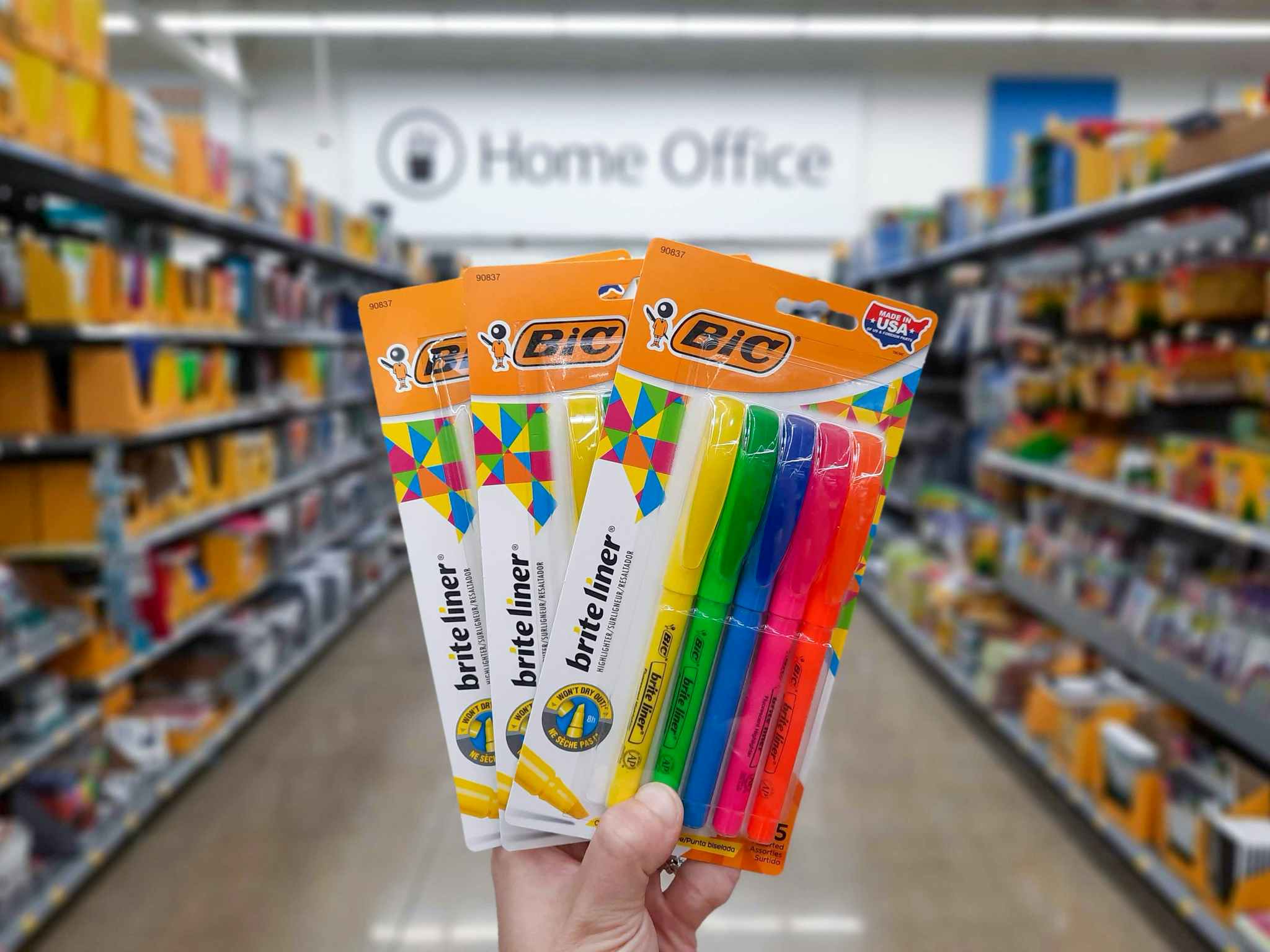 Three packages of BIC Brite Liner Highlighters held in Walmart home office aisle at Walmart