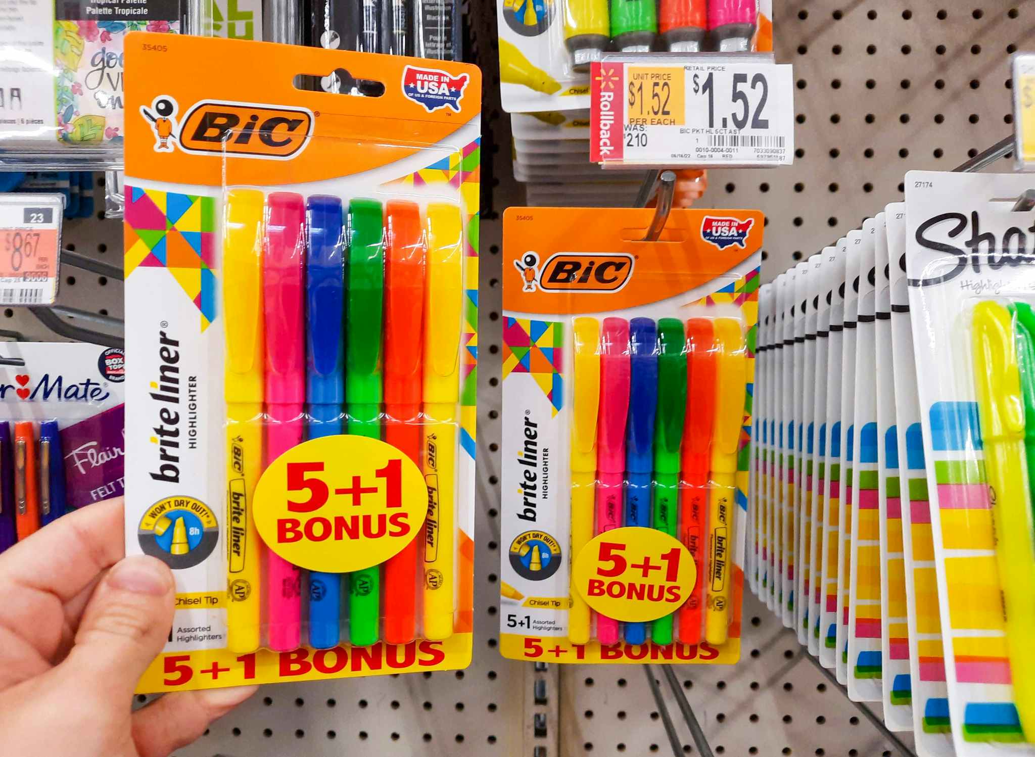 Bic Brite Liner Highlighters held in front of shelf at Walmart. Rollback price tag shows that the price is $1.52, regularly $2.10.