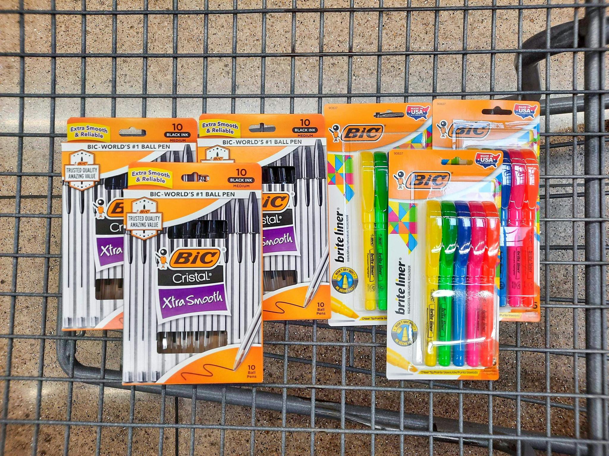 Three package of BIC Cristal Pens and three package of BIC Brite Liner Highlighters in Walmart shopping cart