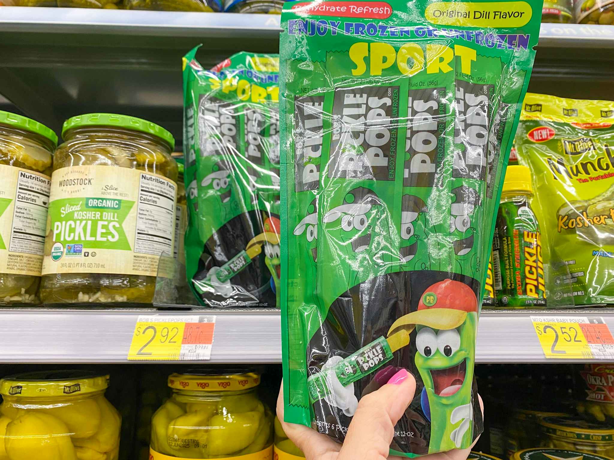 hand holding bobs pickle pops at walmart