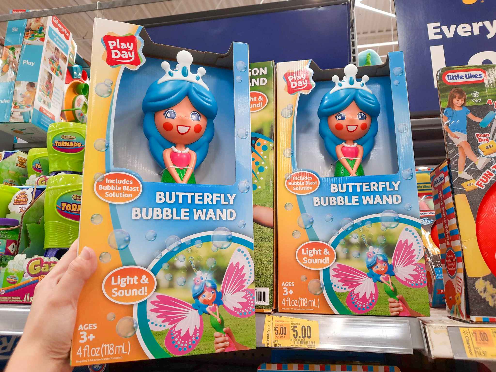 Butterfly Bubble Wand toy held in front of $5 clearance tag at Walmart