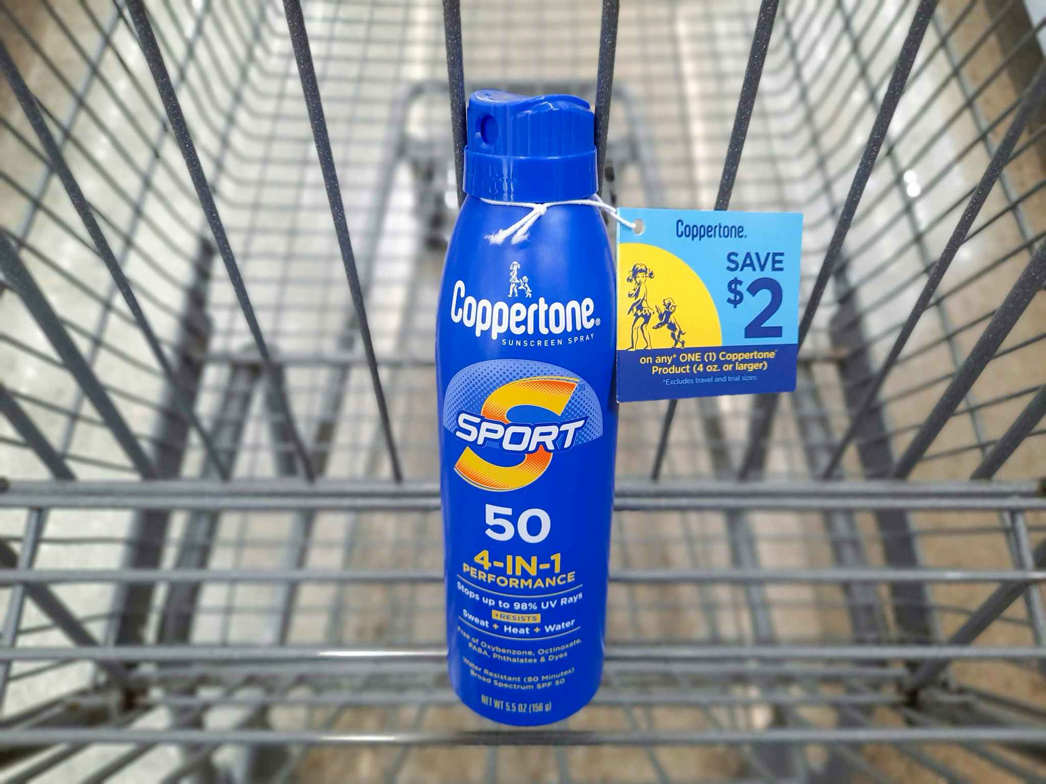 Coppertone Sport Sunscreen product in Walmart shopping cart. A $2 hangtag coupon is attached to the product.