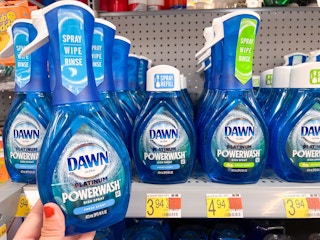 Hand holding a Dawn Power Spray product in front of shelf at Walmart.