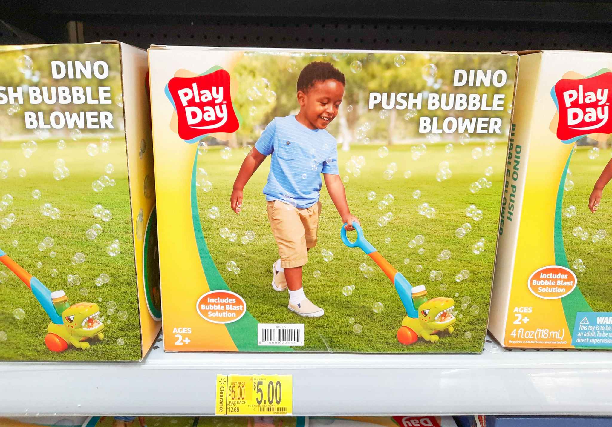 Dino Push Bubble Blower toy on shelf at Walmart. Clearance tag in front of the product reads $5, regularly $12.68.