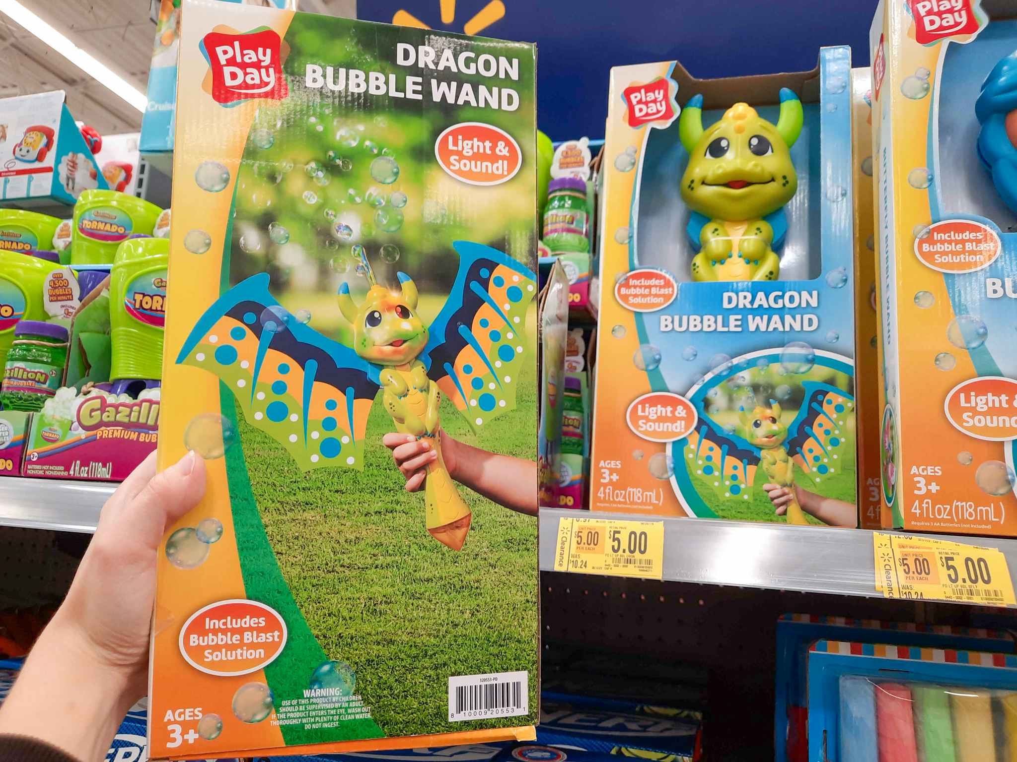 Dragon Bubble Wand toy held in front of $5 clearance tag at Walmart