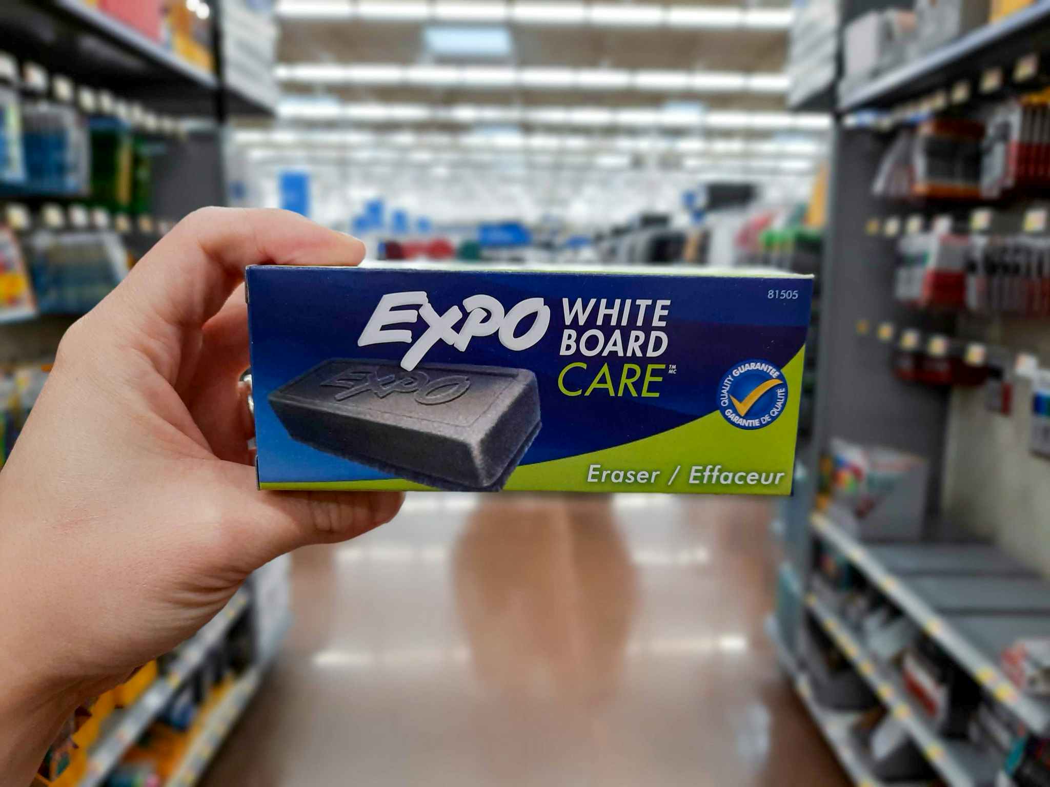 hand holding expo white board eraser